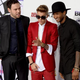Producer Scooter Braun, Justin Bieber and Usher on Dec. 18, 2013, in Los Angeles
Jason Kempin/Getty Images